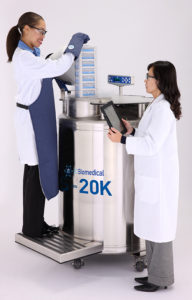 scientists inserting samples in cryogenic storage device